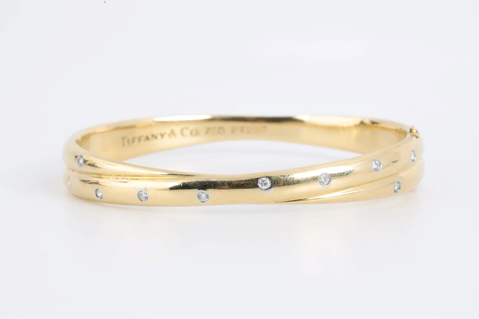 7" Tiffany & Co. 18k Gold Diamond Etoile Crossover Bangle Bracelet (44.12g.)