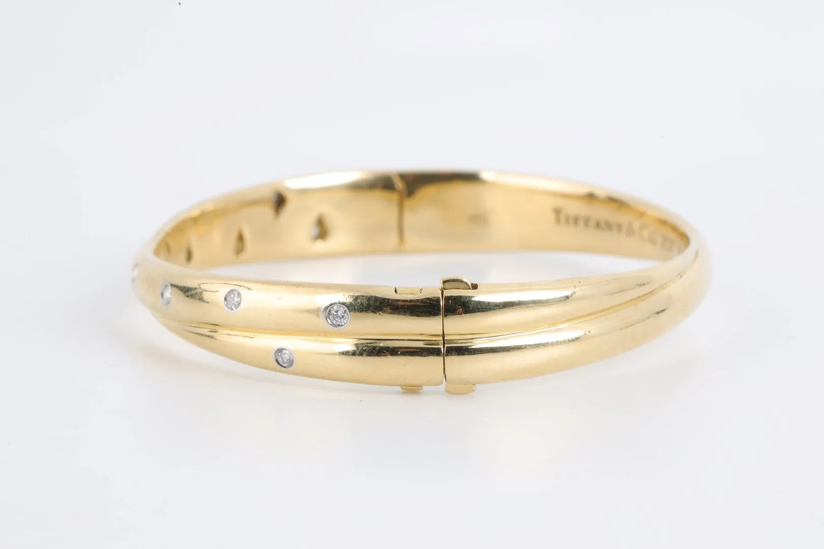 7" Tiffany & Co. 18k Gold Diamond Etoile Crossover Bangle Bracelet (44.12g.)